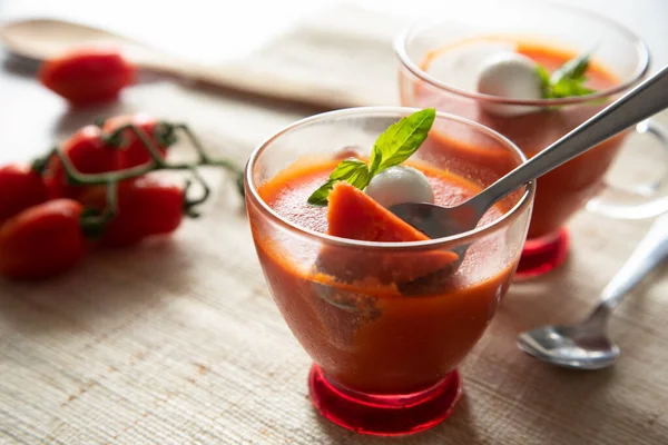 Tomato flan made with gelatin and a small ball of mozzarella.